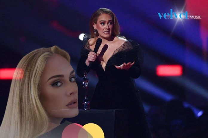 Adele receives an award at the Brit Awards